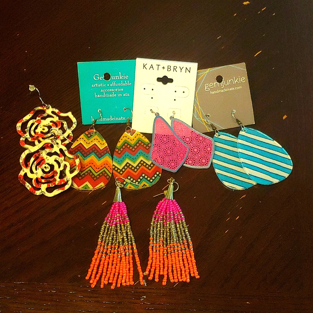 Five pair of dangle earrings.